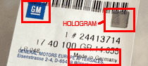 Etykieta oryginalnej części GM z numerem katalogowym i hologramem a także napisem Made in Germany